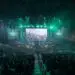 Packed esports stadium with a massive screen displaying gameplay and green stage lighting during Riyadh Masters 2025